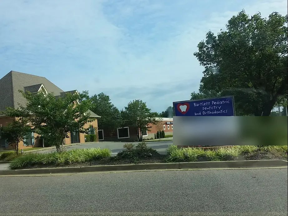 The Bartlett Pediatric Dentistry and Orthodontics office and street sign on Kirby Whitten Road